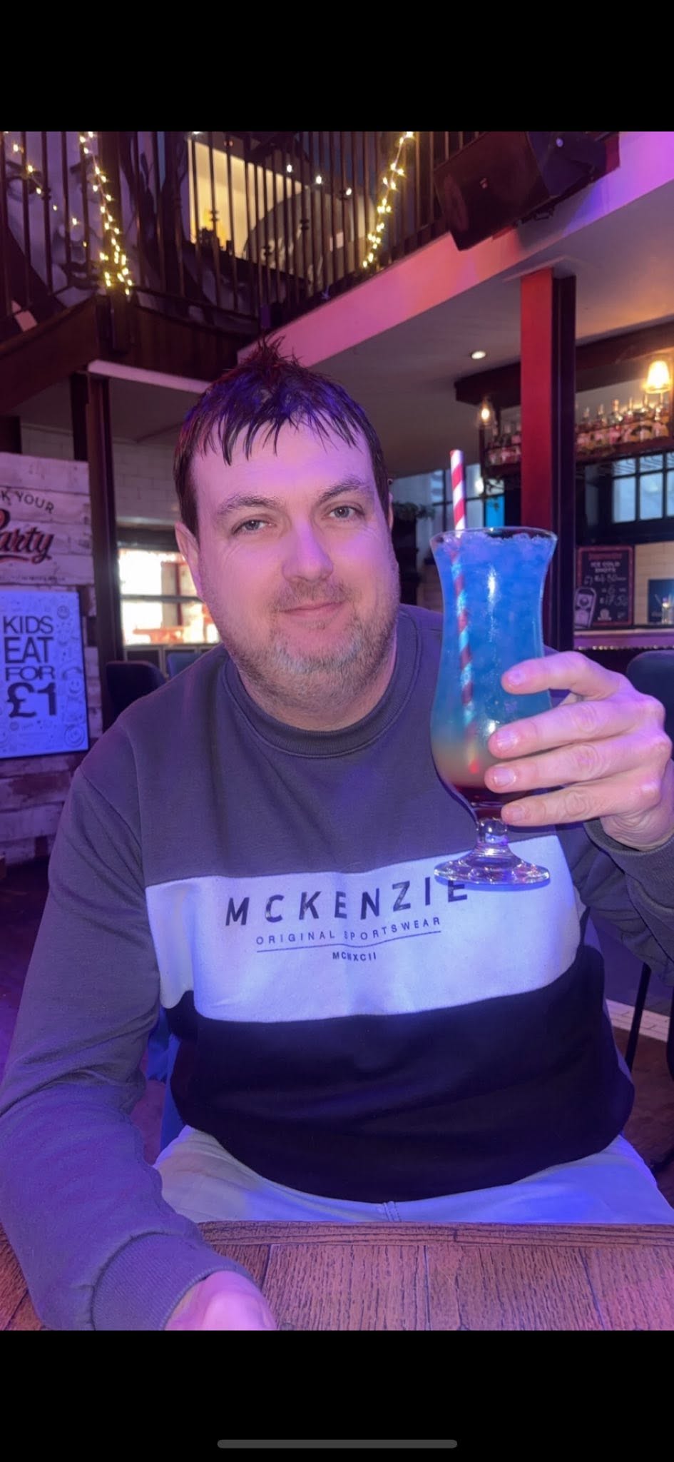 Paul with an extremely blue cocktail